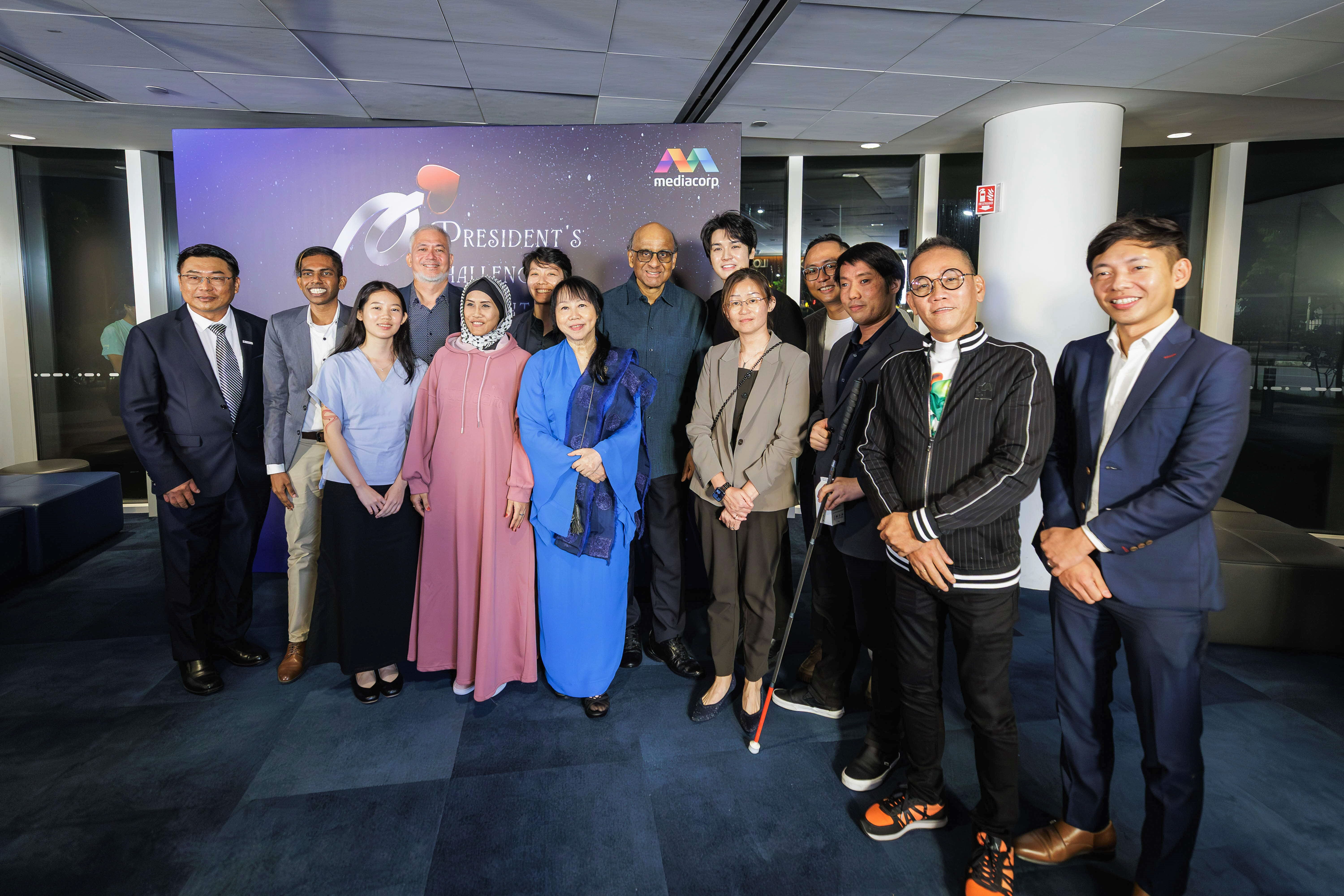 Tweleve fellows with Mr and Mrs Tharman